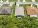 Aerial view of a house with a fenced yard and a covered patio at 4726 Ashurst St, Kissimmee, FL 34758
