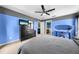 Bedroom featuring a ceiling fan, a dresser, and a view of the en-suite bathroom at 4726 Ashurst St, Kissimmee, FL 34758