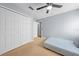 Neutral bedroom features a ceiling fan, closet and carpeted floors at 4726 Ashurst St, Kissimmee, FL 34758