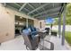 Comfortable covered patio with outdoor furniture and a cozy fire pit at 4726 Ashurst St, Kissimmee, FL 34758