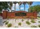 Attractive brick entrance sign for Doral Pointe community surrounded by manicured landscaping and white rock at 4726 Ashurst St, Kissimmee, FL 34758