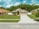 Charming single-Gathering home with a well-manicured lawn and a two-car garage at 4726 Ashurst St, Kissimmee, FL 34758