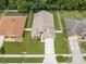 Beautifully maintained single Gathering home with a 2 car garage, lush green lawn and landscaping at 4726 Ashurst St, Kissimmee, FL 34758