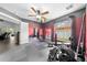 Well-equipped home gym featuring weights and various fitness equipment at 4726 Ashurst St, Kissimmee, FL 34758