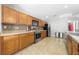 Well-equipped kitchen with stainless steel appliances, ample counter space, and wood cabinetry at 4726 Ashurst St, Kissimmee, FL 34758