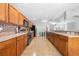 Updated kitchen features stainless steel appliances, light wood cabinets, and a spacious layout for cooking at 4726 Ashurst St, Kissimmee, FL 34758