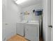 Bright laundry room with white washer and dryer units at 4726 Ashurst St, Kissimmee, FL 34758