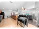 Open-concept living and kitchen area features tile floors and a dining table at 4726 Ashurst St, Kissimmee, FL 34758