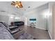 Well-lit living room offers tiered seating, tile flooring, and views into other parts of the home at 4726 Ashurst St, Kissimmee, FL 34758