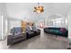 Expansive living space featuring a cozy seating arrangement, tile floors, and a seamless flow into the kitchen at 4726 Ashurst St, Kissimmee, FL 34758