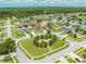 Aerial view of a quiet neighborhood featuring a playground, mature trees and well maintained lawns at 4726 Ashurst St, Kissimmee, FL 34758