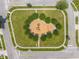 Aerial view of a well maintained playground in a neighborhood with trees at 4726 Ashurst St, Kissimmee, FL 34758