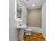 Bathroom featuring a pedestal sink, shower/bath combo, and modern lighting at 4730 Cypress Creek Ranch Rd, St Cloud, FL 34771