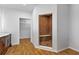 Modern bathroom features a walk-in shower with bench, updated floors, and a closet in a well-lit space at 4730 Cypress Creek Ranch Rd, St Cloud, FL 34771