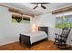 Bedroom with a ceiling fan, natural light, and dark furniture at 4730 Cypress Creek Ranch Rd, St Cloud, FL 34771