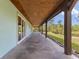 Long covered patio with sturdy beams and outdoor access at 4730 Cypress Creek Ranch Rd, St Cloud, FL 34771