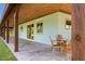 Inviting covered patio with a seating area, wooden beams, and a view of the yard at 4730 Cypress Creek Ranch Rd, St Cloud, FL 34771