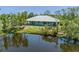 Charming home featuring a serene pond view and a spacious covered porch, perfect for enjoying the natural surroundings at 4730 Cypress Creek Ranch Rd, St Cloud, FL 34771