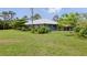 Beautiful home with an expansive lawn and covered parking, offering ample space for outdoor activities and vehicle storage at 4730 Cypress Creek Ranch Rd, St Cloud, FL 34771