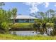 Beautiful waterfront property with a lovely home featuring a covered porch and picturesque pond views at 4730 Cypress Creek Ranch Rd, St Cloud, FL 34771