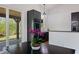 Modern kitchen with dark cabinetry, stainless steel oven, and a view to the outdoor patio, creating a delightful space at 4730 Cypress Creek Ranch Rd, St Cloud, FL 34771