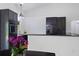 Bright and airy kitchen with dark cabinets, modern appliances, white countertops, and views from a large window at 4730 Cypress Creek Ranch Rd, St Cloud, FL 34771