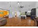 A generous living area featuring an open-concept layout, hardwood floors, and seamless transitions to the kitchen at 4730 Cypress Creek Ranch Rd, St Cloud, FL 34771