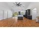 Bright and airy living space with modern finishes, a high ceiling, and seamless access to the kitchen at 4730 Cypress Creek Ranch Rd, St Cloud, FL 34771