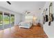 Bright main bedroom with natural light, patio access, and modern decor, creating a relaxing and inviting space at 4730 Cypress Creek Ranch Rd, St Cloud, FL 34771
