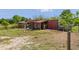 Functional outbuilding and fenced pen designed for livestock and farm animals at 4730 Cypress Creek Ranch Rd, St Cloud, FL 34771