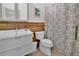 Well-lit bathroom with modern fixtures and a decorative shower curtain at 501 Dunoon St, Ocoee, FL 34761