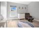 Inviting bedroom featuring a comfortable chair and dresser, complemented by neutral tones at 501 Dunoon St, Ocoee, FL 34761