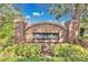 Brick Cheshire Woods community sign surrounded by lush greenery, creating a welcoming entrance at 501 Dunoon St, Ocoee, FL 34761