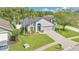 A lovely single-Gathering residence with manicured lawn, complemented by mature trees and a two-car garage at 501 Dunoon St, Ocoee, FL 34761