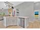 Bright kitchen featuring white cabinetry, stainless steel appliances, and modern countertops at 501 Dunoon St, Ocoee, FL 34761