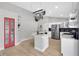 Modern kitchen featuring a central island, stainless steel appliances, and stylish accents at 501 Dunoon St, Ocoee, FL 34761