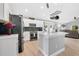 Stylish kitchen showcasing an island, stainless steel appliances, and ample cabinet space at 501 Dunoon St, Ocoee, FL 34761