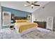 Well-appointed main bedroom featuring a ceiling fan, neutral colors, and ample space at 501 Dunoon St, Ocoee, FL 34761
