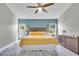 Inviting main bedroom with natural light, a ceiling fan, and tasteful decor at 501 Dunoon St, Ocoee, FL 34761