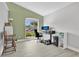 Bright home office featuring lots of natural light, neutral walls, and wood-look tile floors at 501 Dunoon St, Ocoee, FL 34761