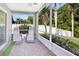 Relaxing screened patio with chairs and lush greenery, perfect for outdoor enjoyment at 501 Dunoon St, Ocoee, FL 34761