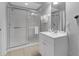 Bathroom featuring walk-in shower, vanity with sink, mirror, and tile flooring at 5038 Tideview Cir # 21, Orlando, FL 32819