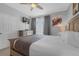 Bedroom featuring balcony access, a gray dresser, and a ceiling fan at 5038 Tideview Cir # 21, Orlando, FL 32819
