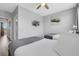 Bedroom showing two twin beds, an ensuite bathroom, and neutral wall art at 5038 Tideview Cir # 21, Orlando, FL 32819