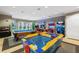 Fun game room featuring an air hockey table, pool table, and various arcade games at 5038 Tideview Cir # 21, Orlando, FL 32819