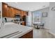Bright kitchen with light countertops, stainless steel appliances, and a cozy breakfast nook with a glass table at 5038 Tideview Cir # 21, Orlando, FL 32819