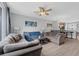 Comfortable living room with large sectional sofa, ceiling fan, neutral walls, and an open floor plan at 5038 Tideview Cir # 21, Orlando, FL 32819