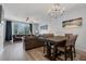 Open concept living and dining area with stylish furniture, neutral walls, ceiling fan and lots of natural light at 5038 Tideview Cir # 21, Orlando, FL 32819