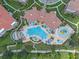 Aerial view showcasing the community pool, splash pad, and manicured landscaping at 5038 Tideview Cir # 21, Orlando, FL 32819