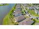 Aerial view of backyard patios and homes along the lake at 5133 Chickadee St, St Cloud, FL 34771